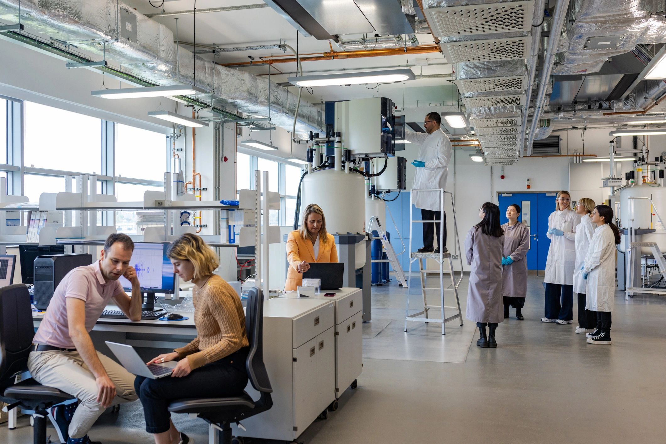 Scientists discussing test results and data in a lab